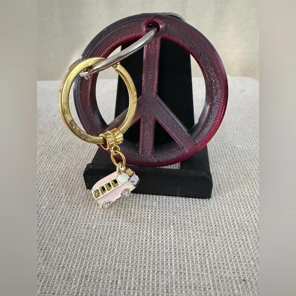 Gold Ring Keychain with Pink Bus Charm also peace sign keychain
